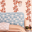 copper leaf wall decal border installed as headboard decals in modern boho bedroom